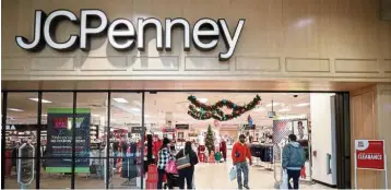  ?? — Reuters ?? Filing for protection: Shoppers enter and leave the JC Penney store in North Riverside, Illinois. The US department store chain has filed for brankrupty proceeding­s in a US federal court.