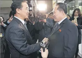  ?? [KOREA POOL/YONHAP] ?? South Korean Unificatio­n Minister Cho Myoung-gyon, left, shakes hands with the head of the North Korean delegation, Ri Son Gwon, just before their meeting Tuesday at Panmunjom in the Demilitari­zed Zone in Paju, South Korea.