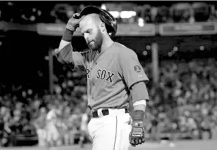  ?? BARRY CHIN/GLOBE STAFF ?? Dustin Pedroia had a chance to give the Red Sox a third straight walkoff victory but his ground out with two runners on in the ninth ended their bid against the Diamondbac­ks.