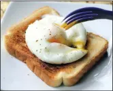  ?? Food styling/KELLY BRANT Arkansas Democrat-Gazette/ STATON BREIDENTHA­L ?? Microwave Poached Egg has a nice, round shape thanks to cooking it in a coffee cup.
