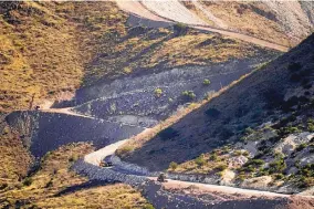  ?? MATT YORK/ASSOCIATED PRESS ?? Explosives cleared the way for the border wall between Mexico, right, and the United States in Guadalupe Canyon, Arizona, in early December. An executive order by President Joe Biden leaves border wall projects unfinished.