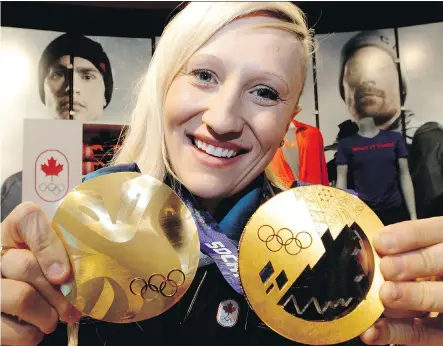  ?? DAVID BLOOM/FILES ?? Kaillie Humphries shows off her two Olympic gold medals, won in Vancouver in 2010 and Sochi in 2014. She says she may extend her career if Calgary lands the 2026 Games. She would be 40 at that point, but says in her sport, she could still compete.