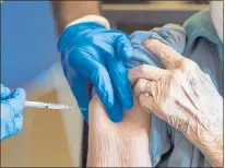  ??  ?? An older adult receives a COVID-19 vaccine from a John Muir Health physician at the Viamonte retirement living residence in Walnut Creek in December 2020.