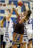  ?? KIRK NEIDERMYER - FOR DFM ?? Governor Mifflin’s Jen Martin goes up for the shot above Garden Spot’s Sydney Nichols and Kaila Stoltzfus at Garden Spot High School in New Holland on Tuesday, Dec. 13.