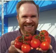 ??  ?? Dr. David Liscombe, a scientist at Vineland Research Station, is part of a team seeking “the perfect tomato” that consumers will fall in love with.