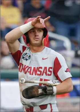  ?? Associated Press ?? To the finals: Arkansas' Casey Martin gestures after scoring against Florida on an RBI-single in the first inning of an NCAA College World Series in Omaha, Neb., Friday.