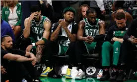  ?? Photograph: Winslow Townson/USA Today Sports ?? The Boston Celtics take in their loss to the Miami Heat in the Eastern Conference finals.