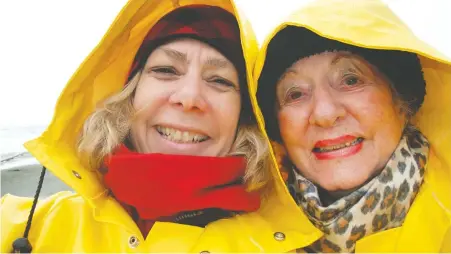  ??  ?? Daphne Bramham and mother Lydia Bramham, pausing during a search for treasures at Long Beach in 2012, will not be meeting this Mother’s Day.