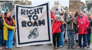  ?? ?? Placards: Protesters make their point to Lord Bathurst, left, who is said to be worth £42 million