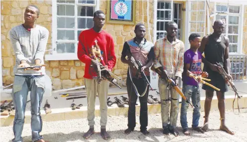  ??  ?? People allegedly arrested with guns, being paraded in Jos yesterday by Operations Save Haven (OPSH), a multi-security taskforce that maintains peace in Plateau State, some parts of Southern Kaduna and Bauchi State Photo: