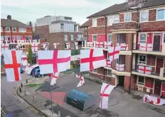  ?? Reuters ?? England fans prepare at the Kirby estate in London, yesterday, ahead of the team’s World Cup match.