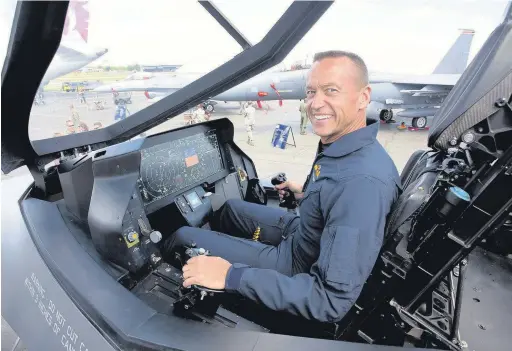  ?? SIMON TAYLOR/ PHOOTO ?? F35 Lockheed Martin test pilot Billy Flinn shows off the cockpit of the aircraft at Farnboroug­h Internatio­nal Airshow.