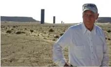  ?? VICTORIA BAUX/GETTY IMAGES ?? Artist Richard Serra stands in front of his permanent art installati­on in Qatar’s desert, 80 kilometres west of the city of Doha.