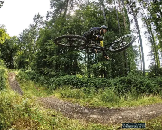  ??  ?? Ed lays it flat as a pancake on Afan Bike Park’s pro line