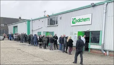  ??  ?? People queuing outside Medichem on Sheppey to get hand gels and washes amid the coronaviru­s outbreak