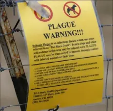  ?? David Zalubowski/Associated Press ?? A warning sign is displayed at a parking lot near the Rocky Mountain Arsenal Wildlife Refuge, in 2019 in Commerce City, Colo. Officials in central Oregon have reported a case of plague in a resident who likely got it from a sick pet cat.