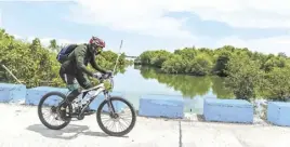  ?? ROMAN PROSPERO ?? OBANDO, Bulacan offers scenic bike trails like this natural fish pond.