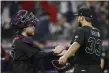  ?? TONY DEJAK — THE ASSOCIATED PRESS ?? Brad Hand, right, is congratula­ted by Roberto Perez after the Indians defeated the Royals, 4-1, on Aug. 23 at Progressiv­e Field.