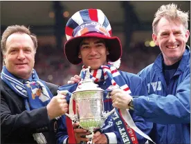  ?? ?? SILVER LINING: Giovanni van Bronckhors­t (middle) with Dick Advocaat (left) and Bert van Lingen after Rangers’ 1999 Scottish Cup final win over Celtic