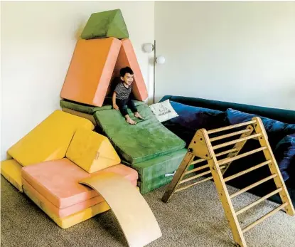  ?? VANESSA GARCIA ?? Cruz Garcia, age 1 1/2, with three Nuggets at his Long Beach home. The four-piece set can be turned into couches, forts, castles, slides, etc. “Some might say it’s a little excessive,” his mom said. “But it works for us.”