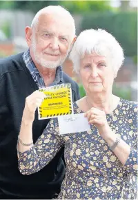  ??  ?? ●●Ernie and Valerie Jackson with their penalty notice Andy Lambert