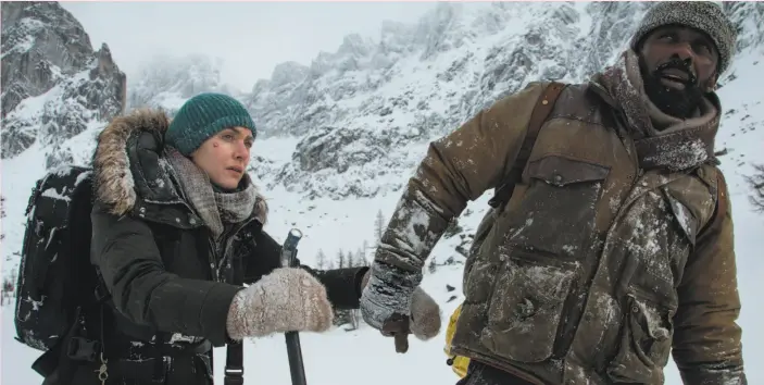  ?? Kimberley French / 20th Century Fox ?? Kate Winslet and Idris Elba are forced to rely on each other for survival in “The Mountain Between Us,” directed by Hany Abu-Assad.