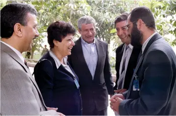  ?? (Reuters) ?? LEILA KHALED smiles while talking to delegates outside a Palestinia­n National Council meeting in the Gaza Strip in the 1990s.