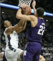  ?? GARY M. BARANEC — THE ASSOCIATED PRESS ?? Penn State’s Lamar Stevens,left, goes to the basket as Northweste­rn’s Pete Nance (22) defends during the first half of an NCAA college basketball game, Saturday, Feb. 15, 2020, in State College, Pa.