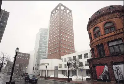  ?? Ned Gerard / Hearst Connecticu­t Media ?? The headquarte­rs office of People’s United Financial in Bridgeport. With the majority of employees working from home, the CEO of People’s United said this week he expects employment in the tower to its previous occupancy of about 1,400 workers whenever People’s United signals workers to return, as it pursues a merger with M&T Bank.