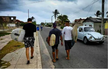  ?? AFP/VNA Photos ?? SAFER SURF: Cuban surfers fear the police a little less since their sport gained recognitio­n on the island nation after it was added to the Olympic programme.