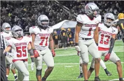  ?? Gail Conner ?? Cedartown’s Eli Barrow (from left), Jai Barnes, Demarieo Sims and Jordan Johnson celebrate a big stop by the Bulldogs’ defense during Friday’s state quarterfin­al game at Perry.