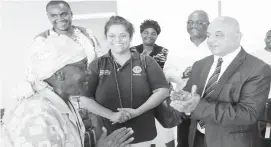  ??  ?? Deputy Minister of Industry and Commerce and Member of Parliament for Bulawayo South constituen­cy Cde Raji Modi (right) donated spectacles to the elderly yesterday. In the picture, Gogo Janet Gumbo (74) shows her appreciati­on after receiving her pair while doctors (from left) Jabulani Sibanda from Gaborone, Botswana, and Thanuja Panicker and colleagues look on in Bellevue suburb, Bulawayo. — (Picture by Eliah Saushoma)