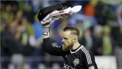  ?? ELAINE THOMPSON — THE ASSOCIATED PRESS FILE ?? Seattle goalie Stefan Frei waves to fans before the first half of the second leg Conference final against the Houston Dynamo last month in Seattle. of the MLS Western