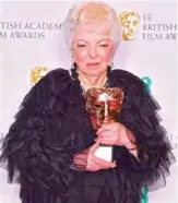  ??  ?? US Film editor Thelma Schoonmake­r pose with her BAFTA Fellowship Award.