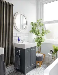  ??  ?? BATHROOM
Bevelled metro wall tiles and dark accents add an industrial feel.
Metro tiles, £20sq m, Topps Tiles. Sottini enamel bath, £915; Utopia Downton freestandi­ng vanity units, price on request, all The Bathroom Studio, Kettering