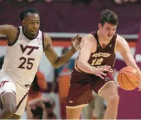  ?? MATT GENTRY/AP ?? Boston College’s Quinten Post, who had 24 points and 10 rebounds, recovers a tipped ball in front of Virginia Tech’s Justyn Mutts during Wednesday night’s ACC game in Blacksburg.