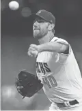  ?? JOE CAMPOREALE/USA TODAY SPORTS ?? Arizona Diamondbac­ks starting pitcher Madison Bumgarner pitches against the Colorado Rockies.