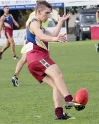  ??  ?? Warragul Industrial­s player Will Jolley boots the ball into attack.