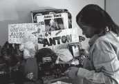  ?? Patrick Semansky / Associated Press file photo ?? In 2019, Jennell Black, mother of Anton Black, looks at a collection of her son’s belongings at her home in Greensboro, Md. Anton Black, 19, died after a struggle with three officers outside the home in 2018.