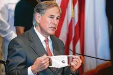  ?? LM Otero / Associated Press ?? Gov. Greg Abbott warns Thursday that hospitals could be slammed when flu season emerges during the pandemic.