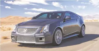  ??  ?? The 2014 Cadillac CTS-V Coupe is yet another of the six GM vehicles contending for a NACTOY award. No other carmarker matched GM’s performanc­e this year.