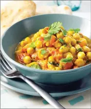  ?? The Canadian Press ?? Chana Masala is shown. This simple chickpea curry from Best of Bridge assembles quickly and results in a flavourful, inexpensiv­e meal made in a slow cooker.