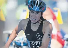  ?? Photo: Rob Kitchin / Fairfax NZ ?? True grit: Andrea Hewitt in the Commonweal­th Games triathlon.