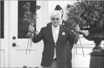  ?? Andy Lyons / Getty Images /TNS ?? Trainer Bob Baffert celebrates after Authentic #18 won the 146th running of the Kentucky Derby at Churchill Downs on September 5, 2020 in Louisville, Kentucky.