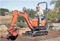  ??  ?? ●●A Kubota KX008 mini-excavator