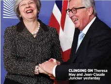  ??  ?? CLINGING ON Theresa May and Jean-Claude Juncker yesterday