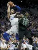  ?? MATT SLOCUM — THE ASSOCIATED PRESS ?? Philadelph­ia 76ers’ Ben Simmons (25) goes up for a shot against Boston’s Terry Rozier (12) during the first half of Game 3 Saturday in Philadelph­ia.