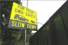  ??  ?? This photograph taken on Dec 14, 2018 shows an animal crossing traffic signboard to warn motorists near road infrastruc­ture works, in the city-state’s remaining green area leading to Singapore Zoo.