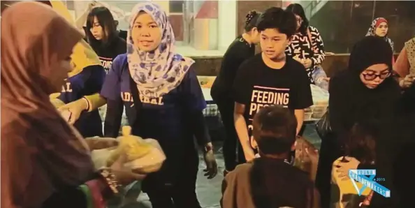  ?? — Photos: Handout ?? Firdaus ( second from right) volunteers at the Feeding the Needy soup kitchen, feeding around 600 homeless people a night.