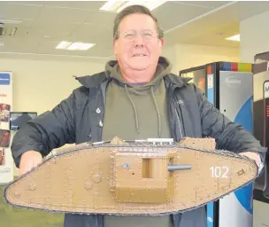  ??  ?? Mike Hartshorne with his hand-made model Mark IV tank